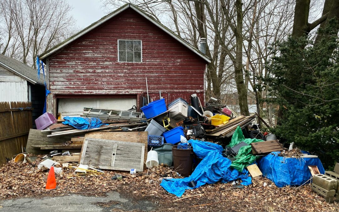 A pile of junk accumulated outside a home